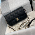 Chanel Pearl Logo Strap Flap Bag Black