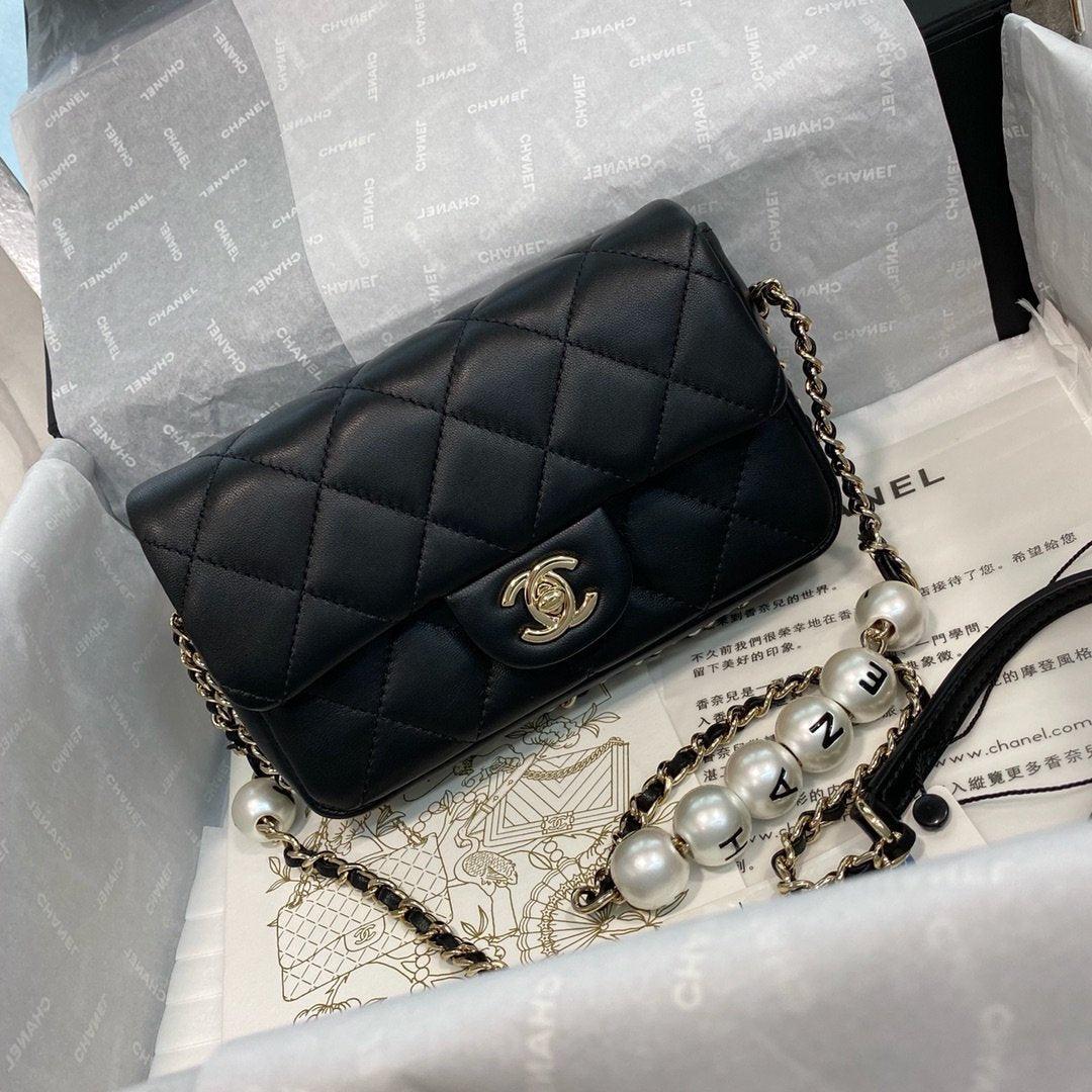 Chanel Pearl Logo Strap Flap Bag Black