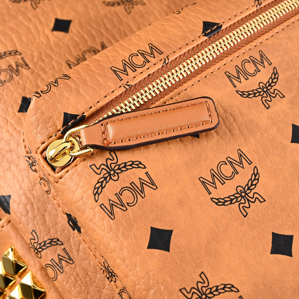 Mcm Stark Visetos Medium Backpack – Cognac Monogram with Gold-Tone Studs - Cognac with Black Monogram Print