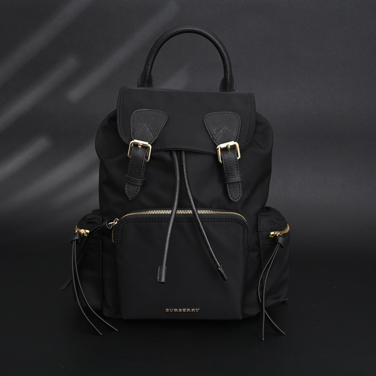 Burberry the Rucksack – Black Nylon & Leather Backpack with Gold-Tone Hardware - Black with Gold Accents