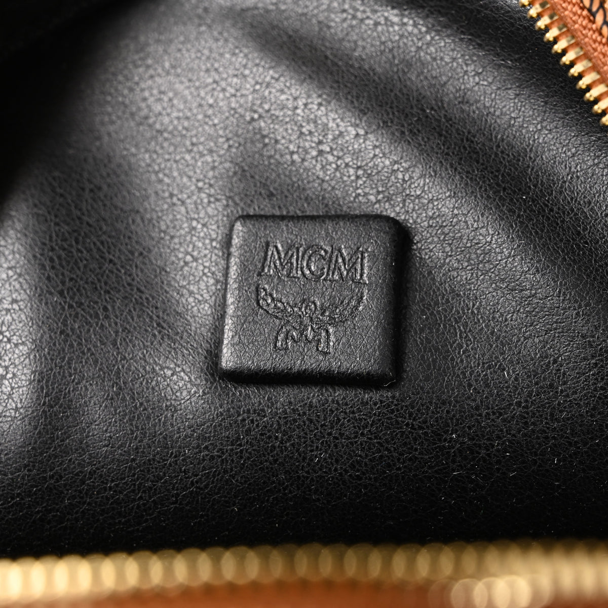 Mcm Stark Visetos Medium Backpack – Cognac Monogram with Gold-Tone Studs - Cognac with Black Monogram Print