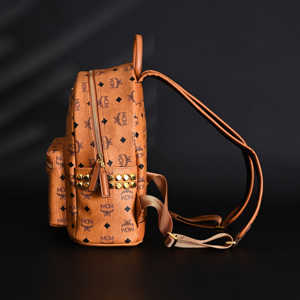 Mcm Stark Visetos Medium Backpack – Cognac Monogram with Gold-Tone Studs - Cognac with Black Monogram Print