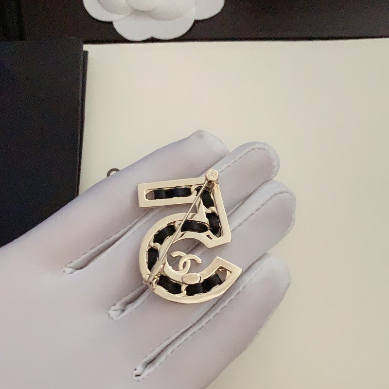 Chanel No.5 Leather Diamond Brooch